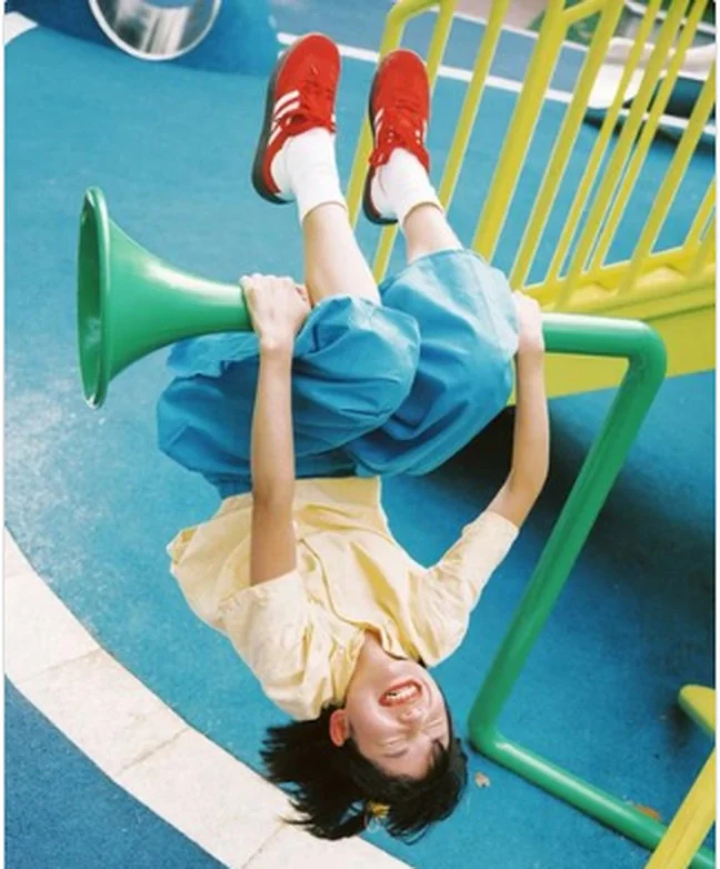 Playground scene with bright blue and yellow